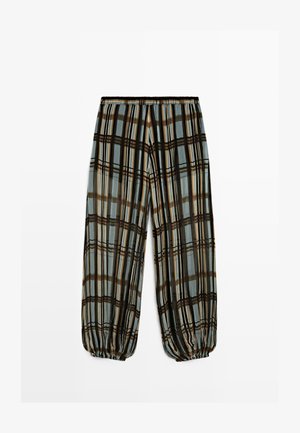 Løse bukser med elastisk talje og manchetter, med lodrette og vandrette ternstriber i brun, sort, creme og lyseblå toner.