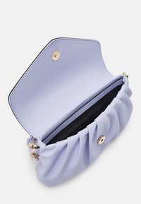 Light purple soft-textured clutch bag with gathered design, black interior, gold hardware, and a round snap closure on top.