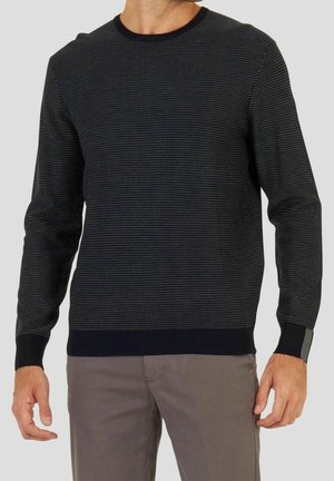 Marineblauer Pullover mit strukturierter Rippung, Rundhalsausschnitt und langen Ärmeln. Verfügt über kontrastierende schwarze Bündchen mit einem kleinen Akzent.