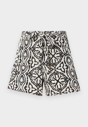 Short taille haute avec motif floral géométrique noir et blanc et ceinture en tissu nouée en nœud à la taille.
