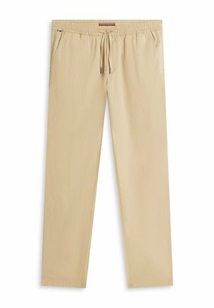 Pantalon décontracté beige avec ceinture élastique et cordon de serrage, poches latérales, et coupe droite.