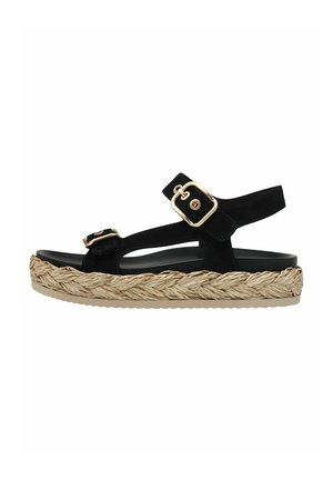 Sandalo nero in suede con due cinturini regolabili, un sottopiede intrecciato in juta e una suola in gomma spessa. Progettato con lati aperti per una migliore traspirabilità.