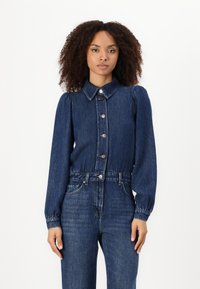 Denim knappskjorte med krageformet halslinje, lange puffermede ermer, elastisk midje og store knapper i en mørk blå vask.