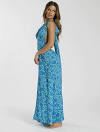 Maxi-jurk in het blauw met groene bloemmotieven, met een open rug en een vloeiende uitstraling. Lichtgewicht stof en een relaxte pasvorm.