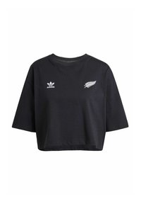 Svart kortärmad t-shirt i bomull. Försedd med vitt Adidas-logo och en stiliserad silverfjäderemblem på framsidan.