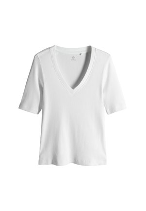 Bílé krátké žebrované tričko s hlubokým výstřihem do V, hladkou texturou a rovnou spodní hranou. Jednoduchý, čistý design.