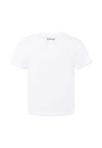 T-shirt bianco a maniche corte in cotone con scollatura rotonda. Presenta un piccolo logo Disney blu sulla parte posteriore vicino alla scollatura.