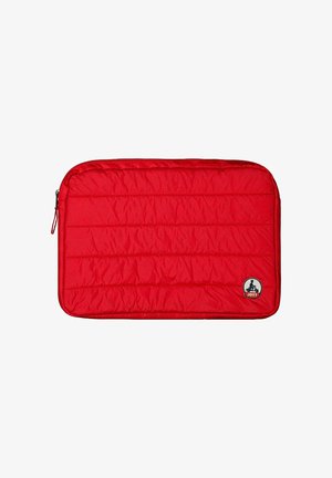 Red padded laptop sleeve with a quilted pattern, zipper closure, and a circular logo patch on the bottom right corner.