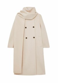 Beige dubbelzijdige jas met een sjawlboord, zijzak en een rechte snit. Gemaakt van een zachte, geweven stof met donkere knopen.
