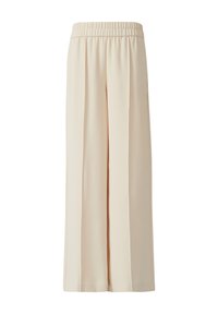 Beige weit geschnittene Hose aus glattem Stoff, mit elastischem Bund und gefälteltem Vorderdesign. Keine Taschen oder sichtbare Hardware.
