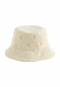 Chapeau seau couleur crème en coton, avec broderie florale, large bord et bord texturé.