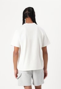 Pal Sporting Goods NEW TRADEMARK UNISEX - Nyomott mintás póló - off-white