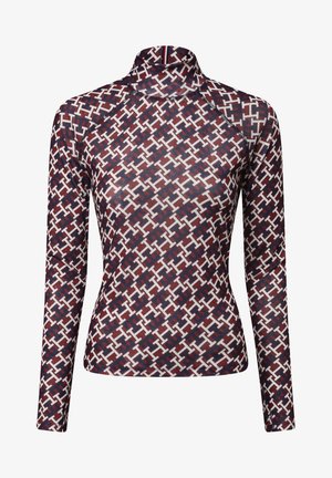 Haut à manches longues avec un col montant, en tissu extensible, dans un motif géométrique rouge, blanc et marine, avec des manches raglan.