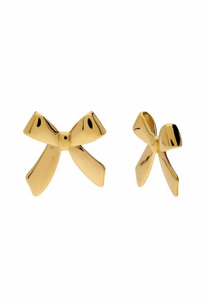 Gold-tone metal earrings shaped like stylized bows with smooth, reflective surfaces, shown from front and side angles.