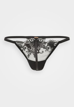 Thong en dentelle noire avec une broderie florale complexe, un dos en mesh et de fines bretelles latérales, un panneau avant noir uni et une découpe à l'arrière.