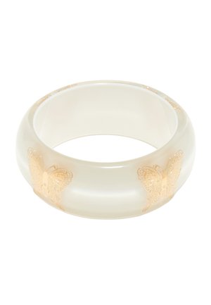Translucent white resin bangle bracelet with smooth surface and gold butterfly designs evenly spaced around the band.