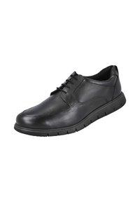 Zapato de hombre negro de cuero con cordones, detalles de costuras y suela de goma flexible, mostrado en ángulo para ver el lado exterior y la parte superior.