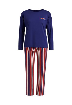 Top met lange mouwen in marineblauw met een klein gestreept zakdetail, gecombineerd met een broek met verticale strepen in rood, wit en blauw.