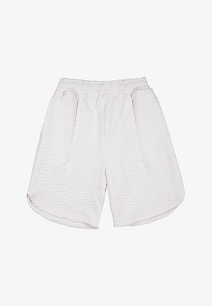 Shorts blancs texturés avec une taille élastique, dotés de deux poches avant et d'une coupe large et lâche. Motif de tissu légèrement froncé.