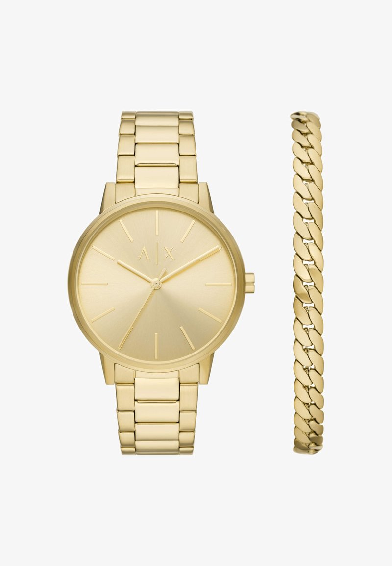 Reloj de pulsera con tono dorado, esfera minimalista y pulsera de eslabones. Incluye una pulsera de cadena dorada a juego con eslabones ovalados.