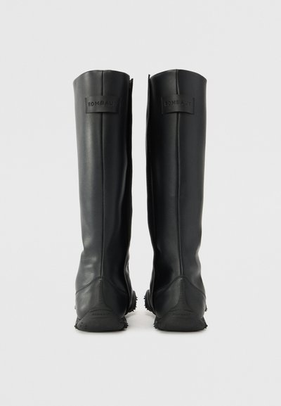 Black knee-high boots made of smooth synthetic material, featuring a rounded toe and textured rubber sole with branding on the back.