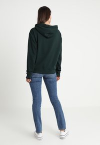 Zalando Essentials Jersey con capucha - dark green