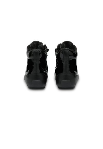Black patent ankle boots with faux fur lining, smooth finish, rear zippers, and textured rubber soles, designed for comfort and warmth.