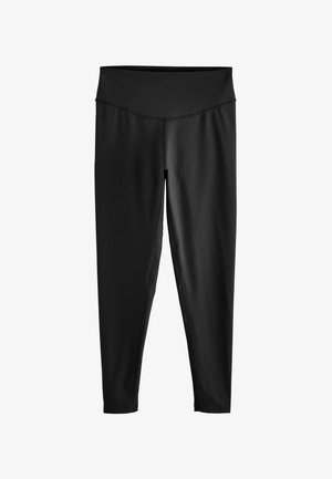 Czarne legginsy o wysokim stanie, pełnej długości, z płaskimi szwami, wykonane z gładkiej, elastycznej tkaniny.