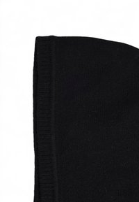 Black beanie made of soft knit material. Features a ribbed edge with a smooth, uniform texture and no visible patterns or hardware.