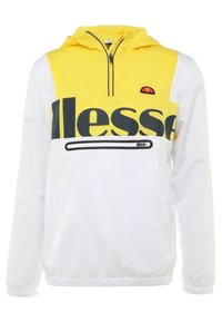 Pullover jacket featuring a yellow and white design, a half-zip front, elastic cuffs, and a logo on the chest. Smooth, lightweight material.