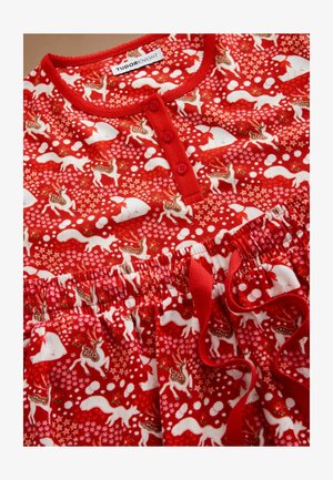 Czerwony zestaw piżamowy z guzikiem przy dekolcie, ozdobiony zabawnym wzorem jeleniów, królików i gwiazd, wykonany z miękkiego materiału, z elastyczną talią.