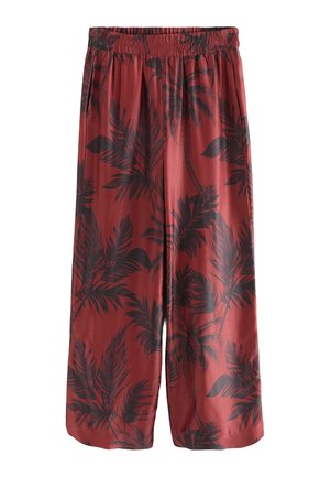 Red culottes with a black palm leaf pattern, featuring an elastic waistband and a loose, flowing design. Smooth, lightweight fabric.