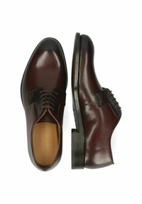 Braune Leder-Dressschuhe mit glatter Oberfläche, runder Zehenform, Schnürdesign und gestapeltem Absatz. Auffällige Nähte setzen besondere Akzente.