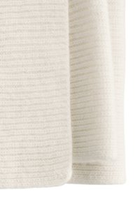 Textured, soft white knit fabric with subtle horizontal stripes, featuring a clean edge and a supple drape. Ideal for garments or blankets.