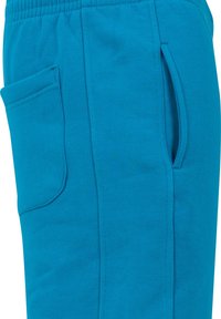 Pantaloni de trening turcoaz din amestec de bumbac, cu un buzunar lateral, talie elastică și textură netedă. Concepuți pentru confort și ușurință.