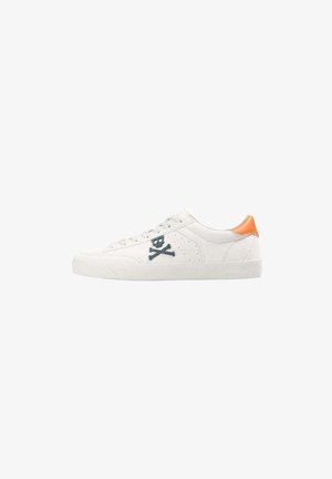 White sneaker with a textured upper, blue embroidered skull and crossbones design, and an orange accent on the heel. Flat rubber sole.