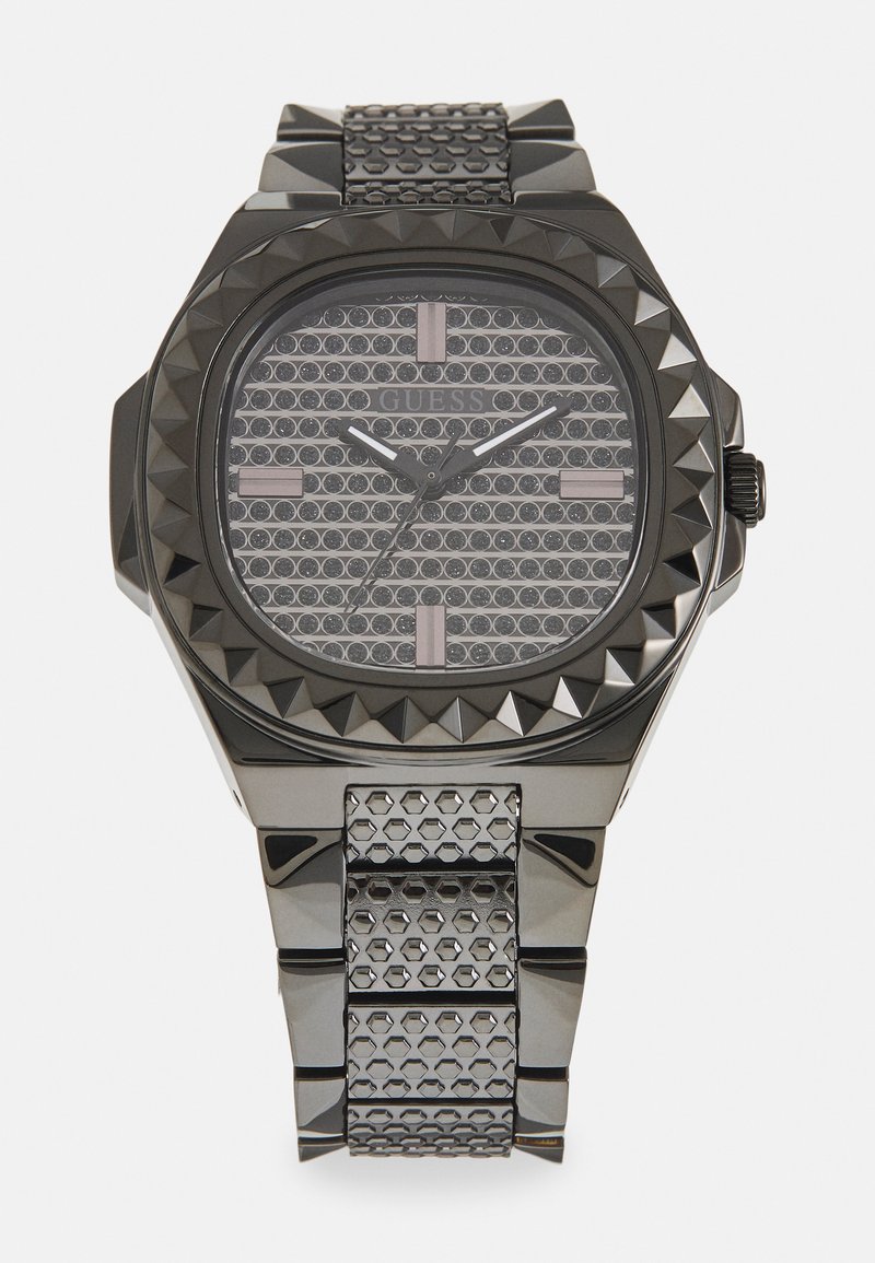 Black stainless steel watch with an octagonal case, spiked bezel, textured silver-tone dial, and hexagonal-patterned strap.