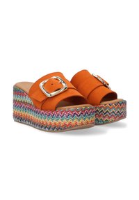Orange suede wedge sandals with a wide strap, silver buckle, and multicolored woven platform featuring a zigzag pattern.