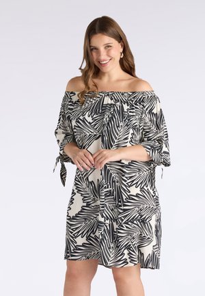 Vestido off-the-shoulder en crema con patrón de hojas negras, con mangas cortas, detalles de corbata y un escote elástico para mayor comodidad.