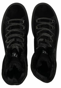 Black high-top boots with suede material, metallic laces, and faux fur lining. Features circular eyelets and a textured black sole.