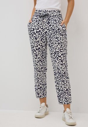 Navy blue tapered pants with a white leopard print, elastic waistband, side pockets, and a drawstring for adjustable fit.