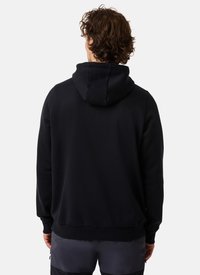 Hoodie noir avec une capuche à cordon, coupe décontractée, poignets et ourlet côtelés, et texture de tissu douce. Aucun motif ou logo visible.