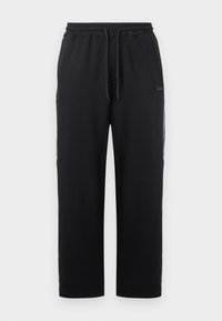 Μαύρο παντελόνι τζόγερ από βαμβακερό μείγμα, με ελαστική μέση και κορδόνι, πλαϊνές τσέπες και ίσια γραμμή στο πόδι.