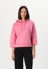Felpa con cappuccio rosa, dal fit rilassato, maniche a 3/4, cordini regolabili e lacci laterali; tessuto morbido e design semplice.