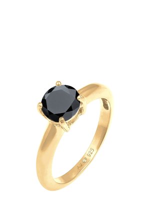 Goldener Ring mit einem runden, facettierten schwarzen Edelstein, gehalten von sechs Krappen, mit Ag 925 markiert, was auf eine Sterling-Silber-Basis hinweist.