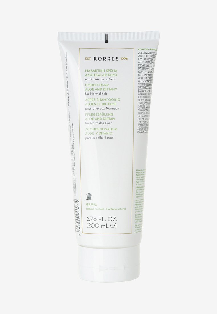 Witte tube met conditioner met groene tekst en afbeeldingen. Bevat productnaam, doel en meertalige etiketten. Formaat 200 mL.