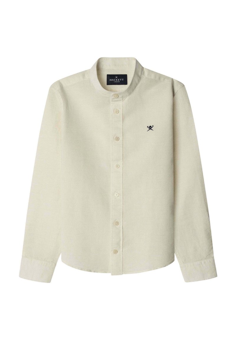 Camisa de manga larga abotonada en tejido de color beige claro con una textura suave. Presenta un cuello mao y un pequeño logo negro en el pecho.