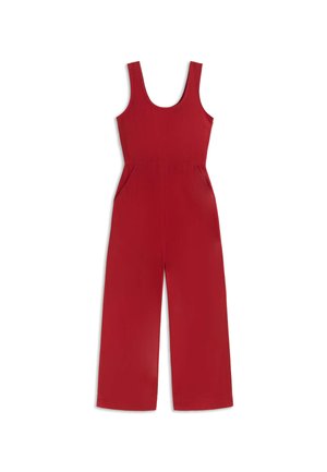 Combinaison rouge sans manches à jambes larges, encolure dégagée, taille cintrée et poches latérales, étalée à plat sur fond blanc.
