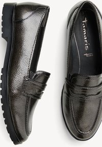 Dark metallic slip-on loafers with textured leather upper, stitched accents, and a durable rubber sole. Size 37 displayed inside.