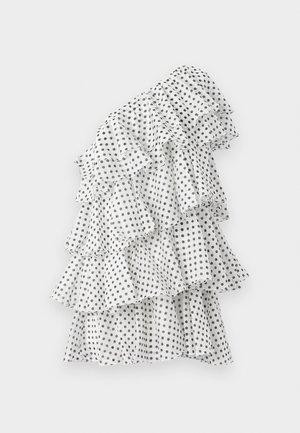White dress with black polka dots, featuring multiple ruffled layers, asymmetric design, and lightweight fabric.